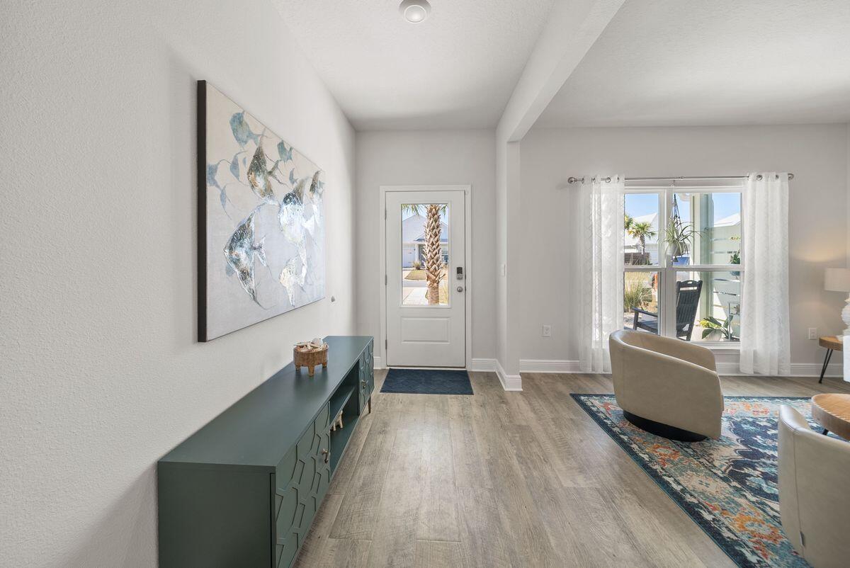 774 Backwater Road Port St. Joe, FL 32456 - Photo 6 of 65 a living room with furniture and wooden floor