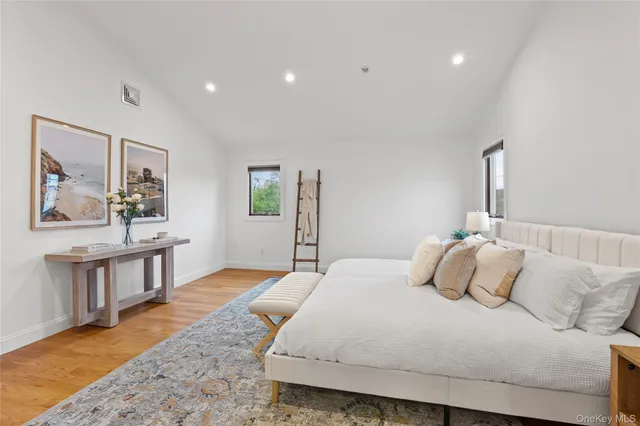 a bathroom with a bath tub with a glass door shower