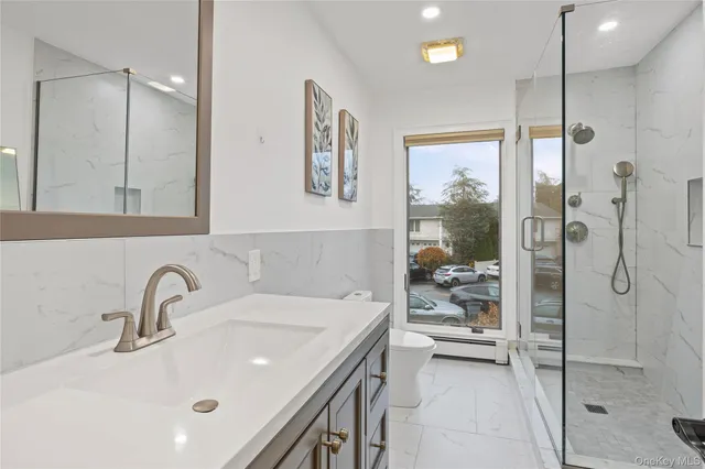 a view of a room with wooden floor and window