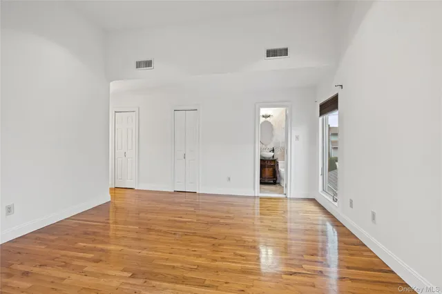 a bathroom with a toilet a sink and a mirror