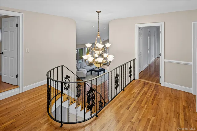 a view of an empty room with stairs and toys