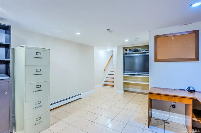 a view of a backyard with seating space