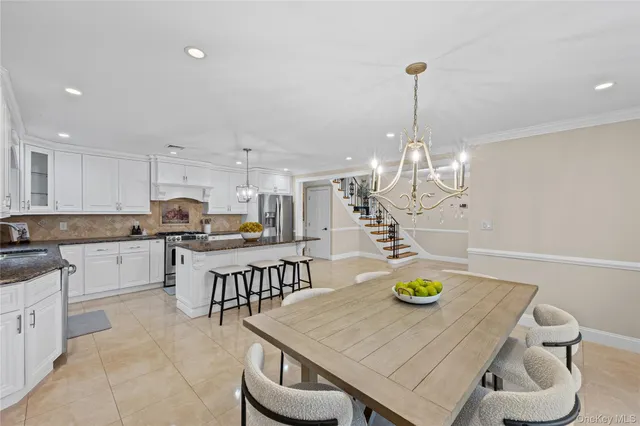 a kitchen with sink and refrigerator