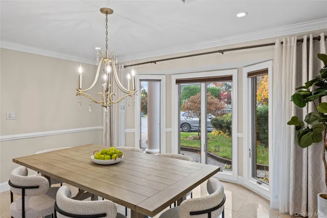 a view of a room that has a table and chairs