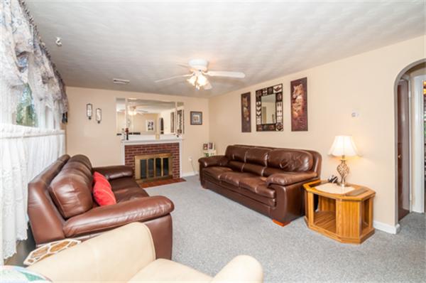 34 Rangeway Road Billerica, MA 01862 - Photo 11 of 30 a living room with furniture a fireplace and a window