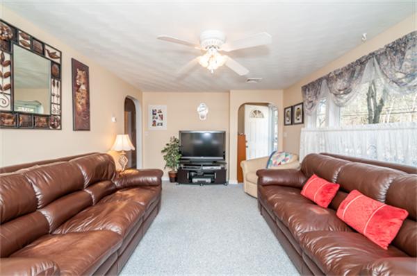 34 Rangeway Road Billerica, MA 01862 - Photo 12 of 30 a living room with furniture and a flat screen tv