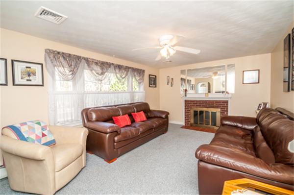 34 Rangeway Road Billerica, MA 01862 - Photo 13 of 30 a living room with furniture and a fireplace
