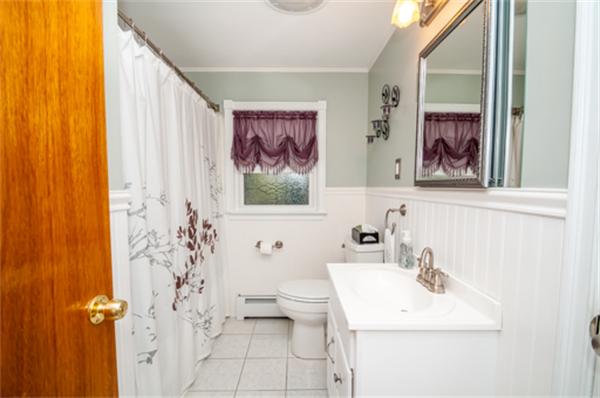 34 Rangeway Road Billerica, MA 01862 - Photo 14 of 30 a bathroom with a sink mirror and toilet
