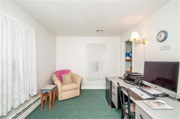 34 Rangeway Road Billerica, MA 01862 - Photo 19 of 30 a bedroom with a bed and a chandelier