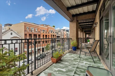 a view of balcony with a potted plant and stairs