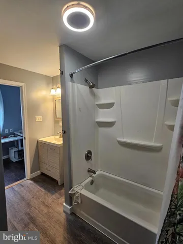 a white toilet sitting in a bathroom