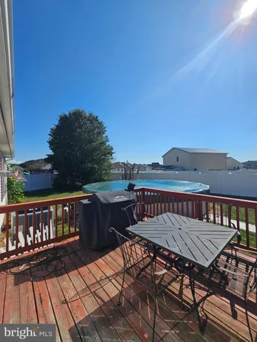 a view of a roof deck with patio