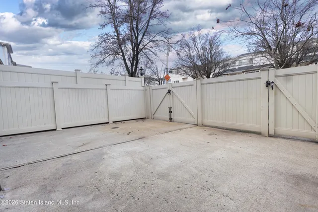 a view of a patio with a table and chairs