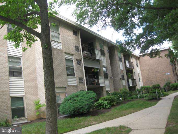 3845 St Barnabas Road, Unit 201 Suitland, MD 20746 - Photo 1 of 1 a front view of a house with garden