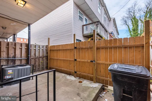 a view of a balcony with furniture