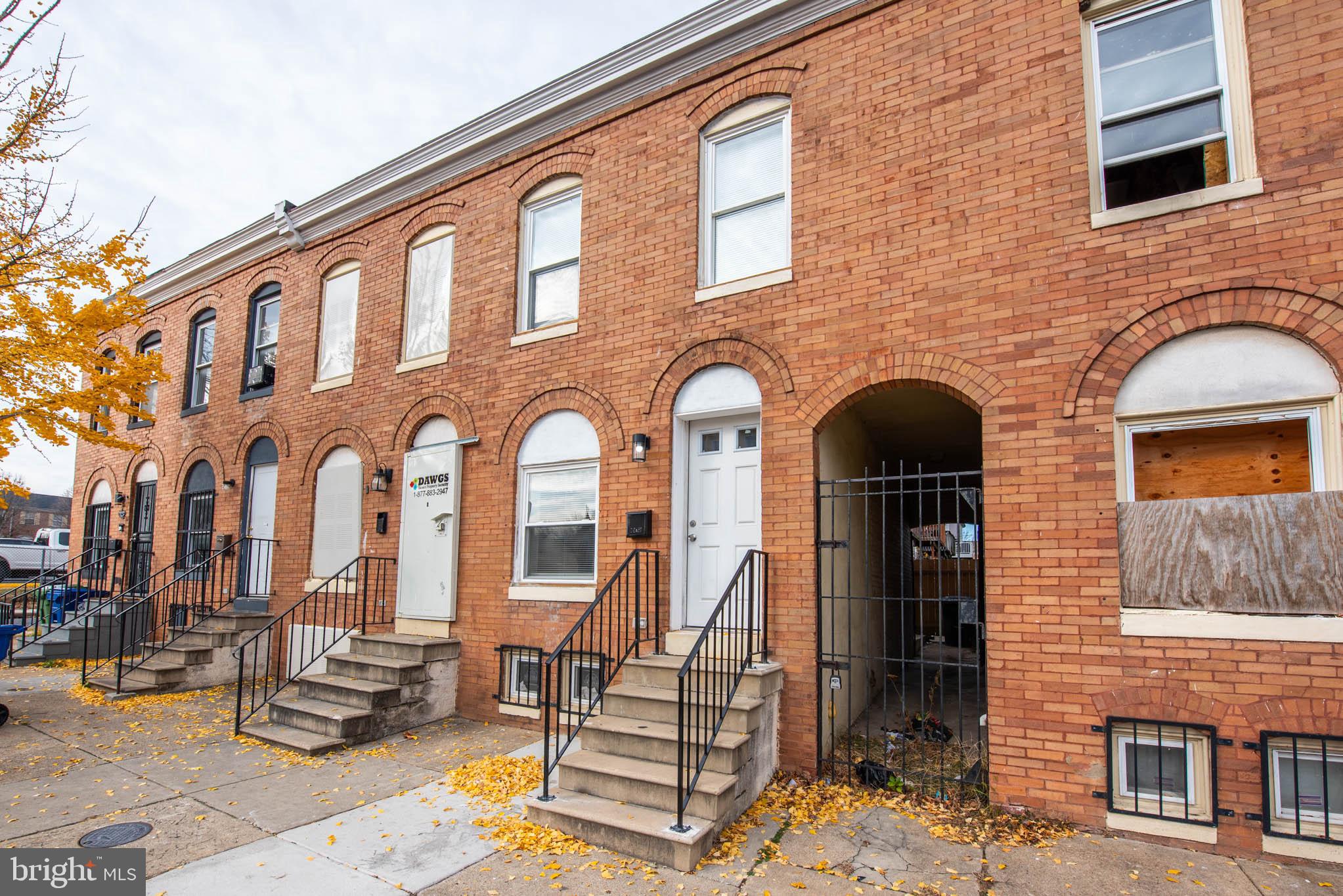 554 Gold Street Baltimore, MD 21217 - Photo 22 of 23 a front view of a house with many windows