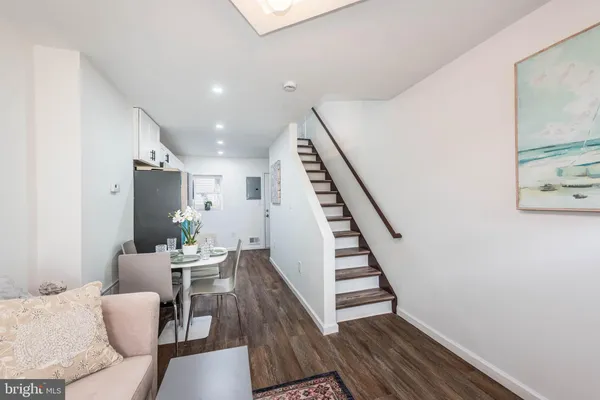a dining room with furniture and entryway