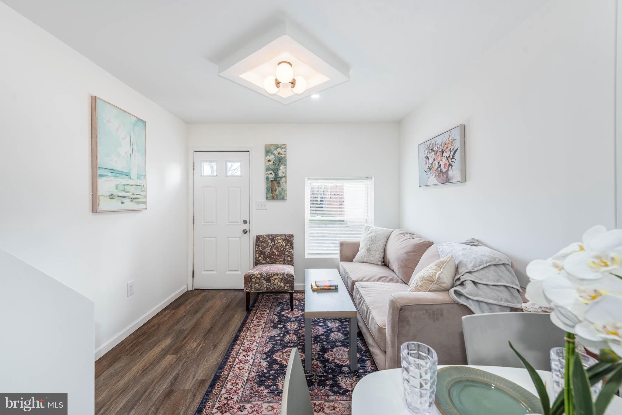 554 Gold Street Baltimore, MD 21217 - Photo 5 of 23 a living room with furniture and wooden floor