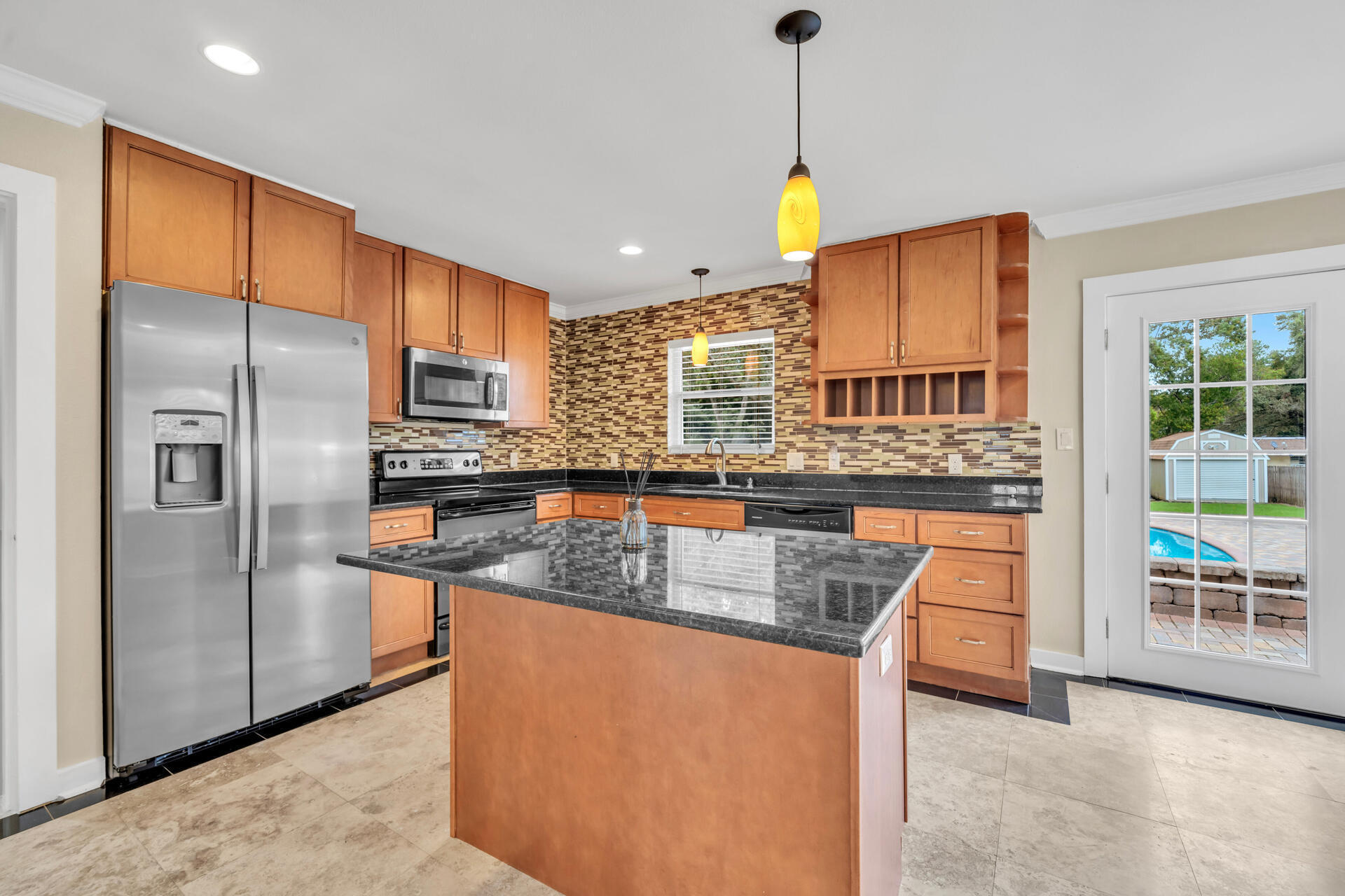536 Benning Drive Destin, FL 32541 - Photo 13 of 46 a kitchen with stainless steel appliances granite countertop a refrigerator a sink and a stove