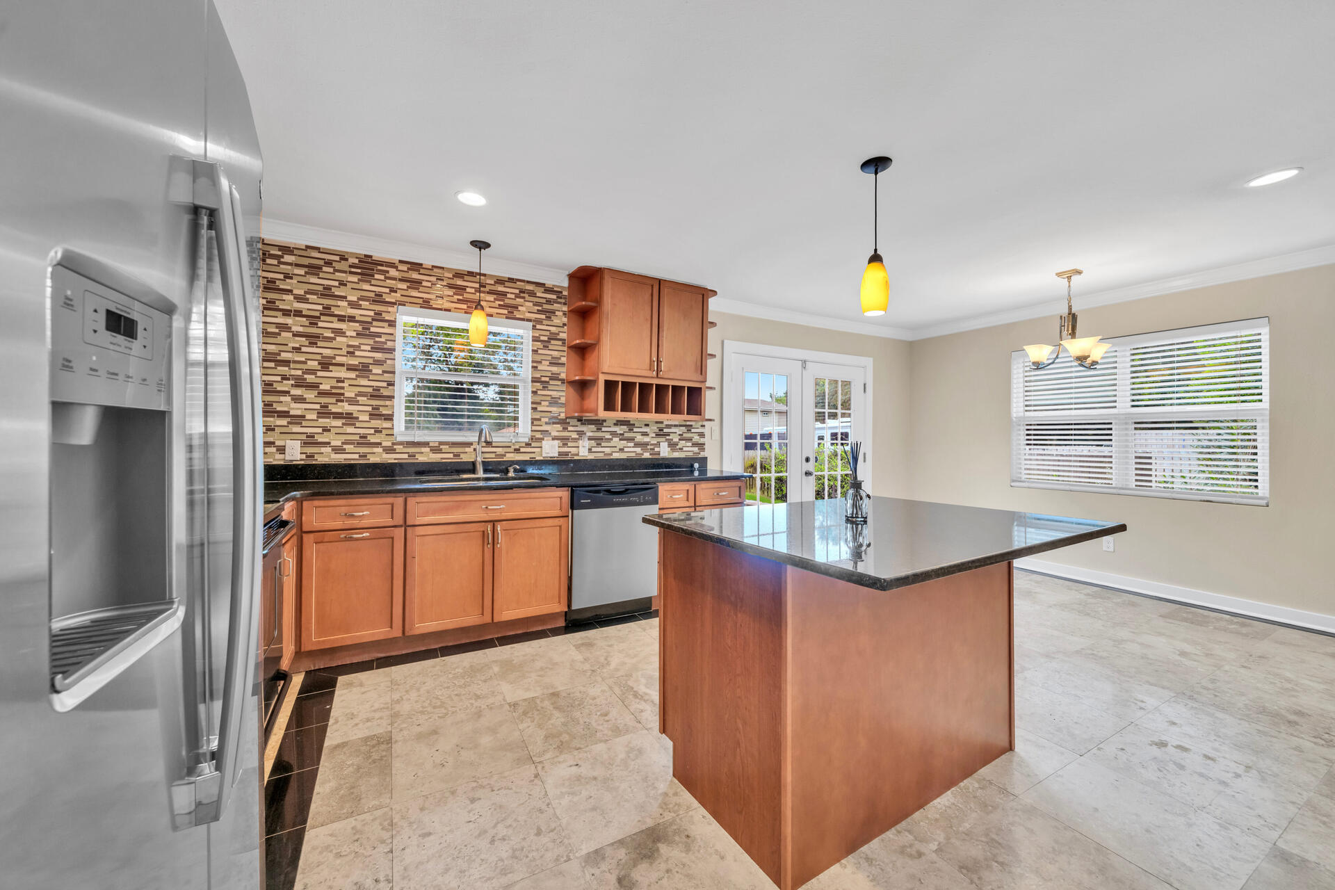 536 Benning Drive Destin, FL 32541 - Photo 14 of 46 a kitchen with stainless steel appliances granite countertop a stove a sink and a refrigerator