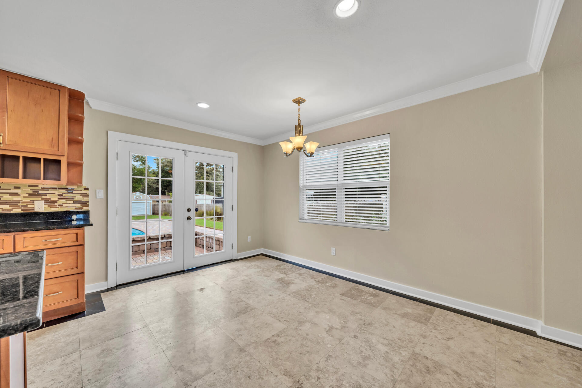 536 Benning Drive Destin, FL 32541 - Photo 15 of 46 an empty room with fireplace and windows