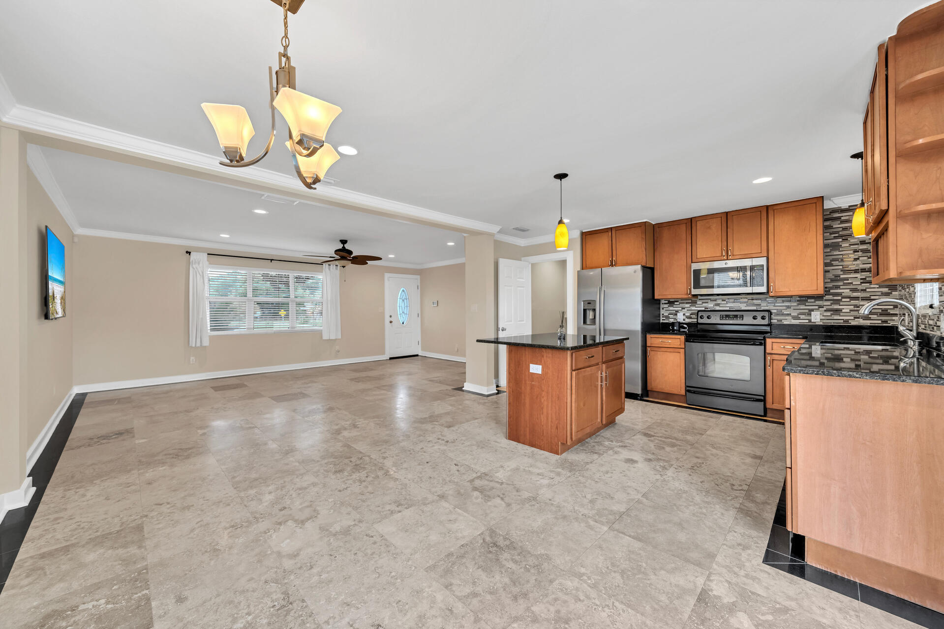 536 Benning Drive Destin, FL 32541 - Photo 17 of 46 a kitchen with stainless steel appliances granite countertop a stove and a refrigerator