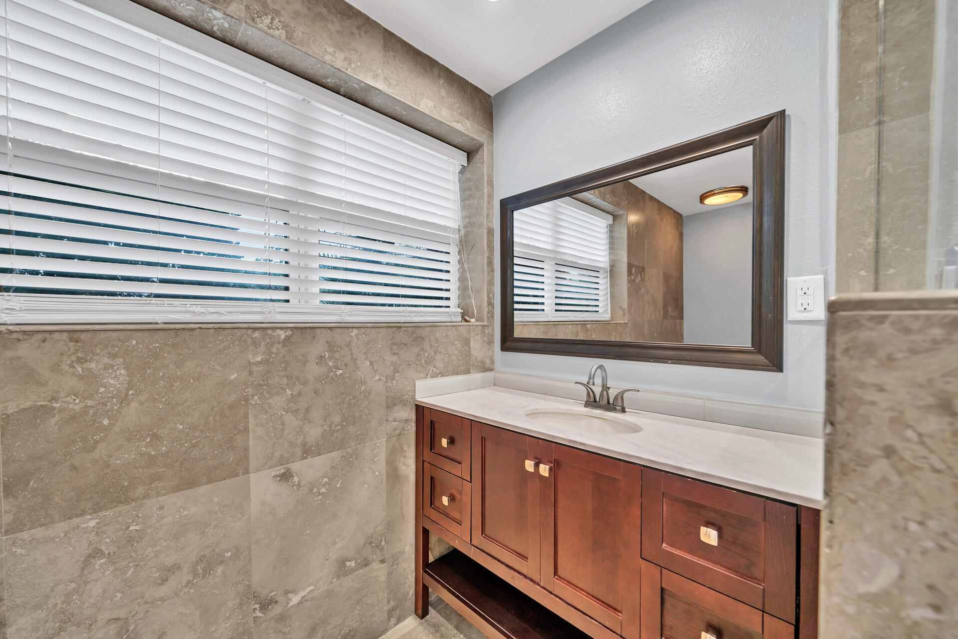 536 Benning Drive Destin, FL 32541 - Photo 19 of 46 a bathroom with a sink and a mirror