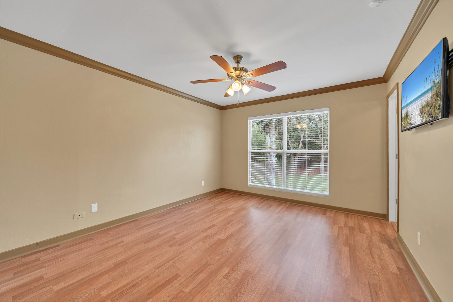 536 Benning Drive Destin, FL 32541 - Photo 30 of 46 a view of an empty room with a window and wooden floor