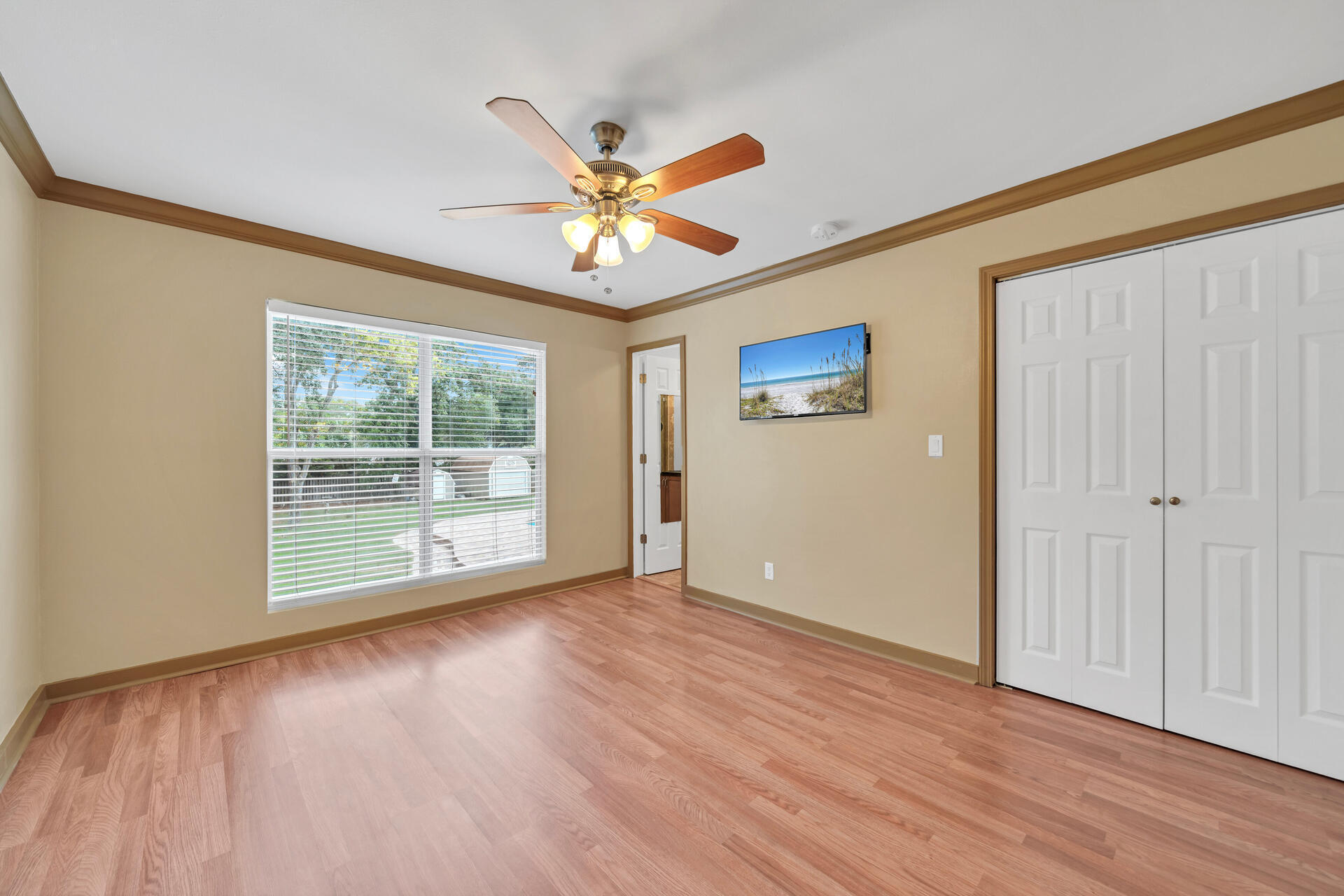 536 Benning Drive Destin, FL 32541 - Photo 31 of 46 a view of an empty room with a window and wooden floor