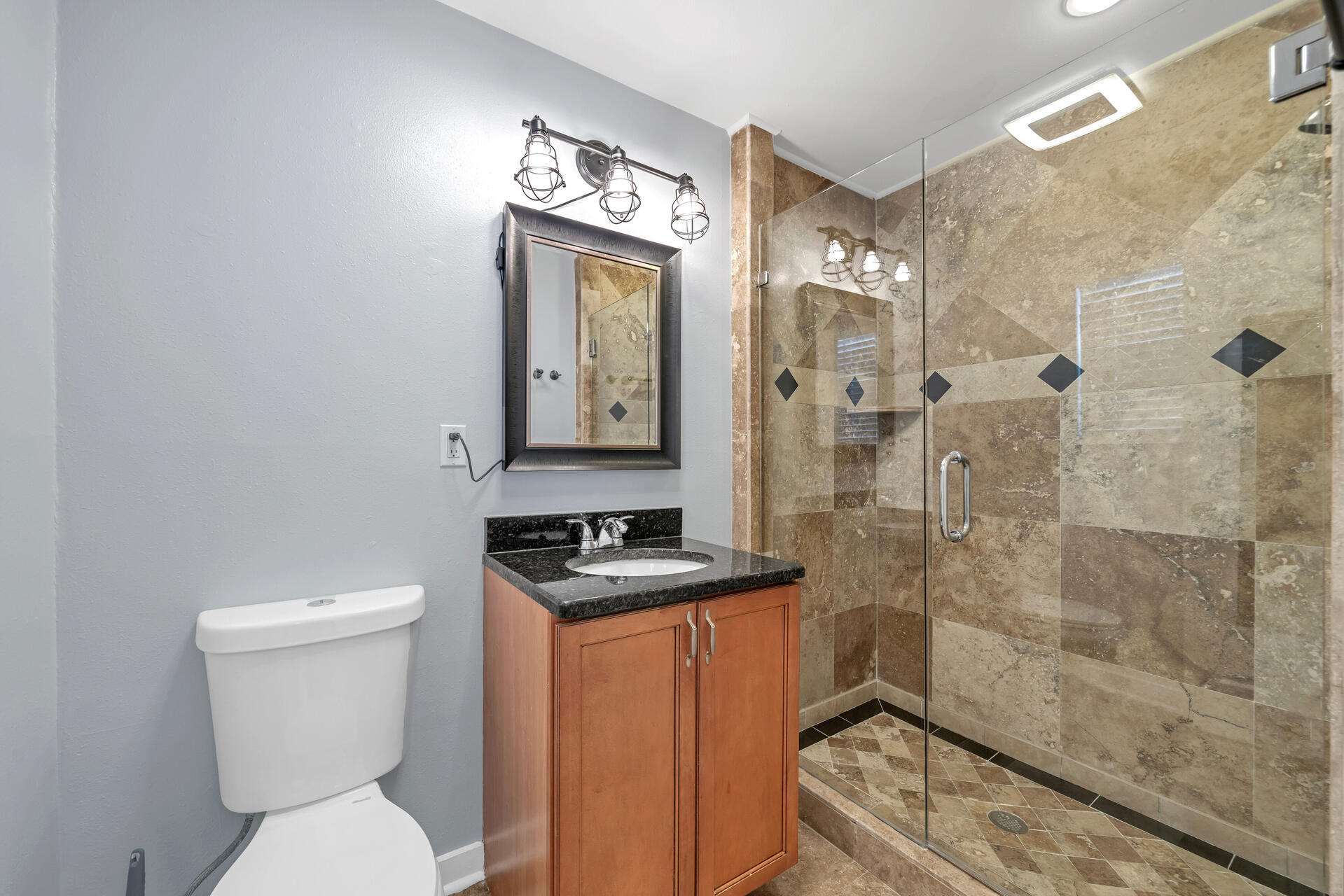 536 Benning Drive Destin, FL 32541 - Photo 32 of 46 a bathroom with a toilet a sink and shower