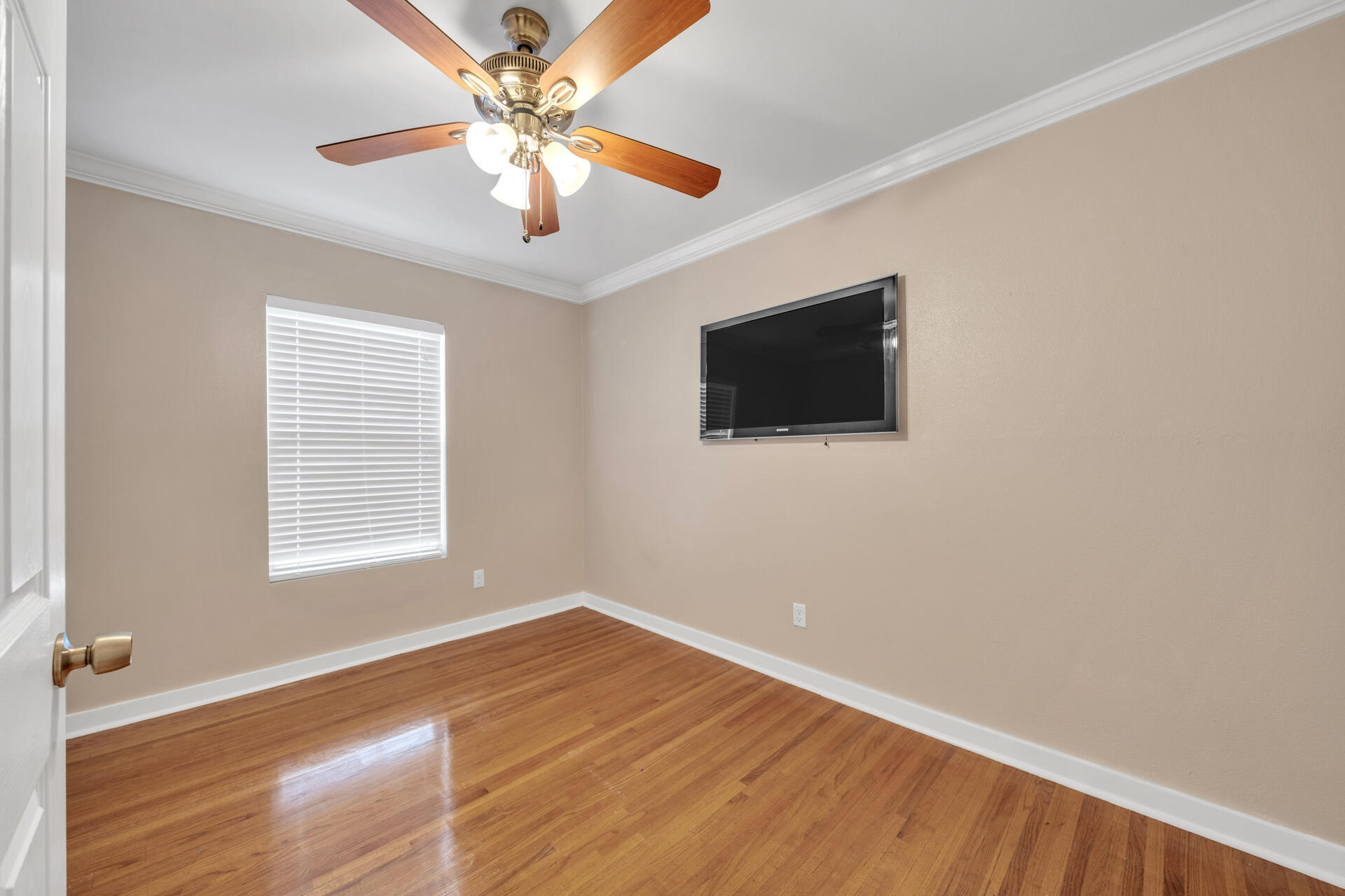 536 Benning Drive Destin, FL 32541 - Photo 33 of 46 a view of an empty room with wooden floor and a window
