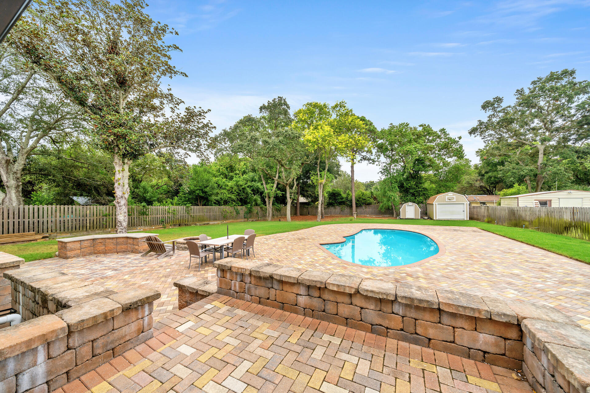 536 Benning Drive Destin, FL 32541 - Photo 38 of 46 a view of a swimming pool and lounge chairs