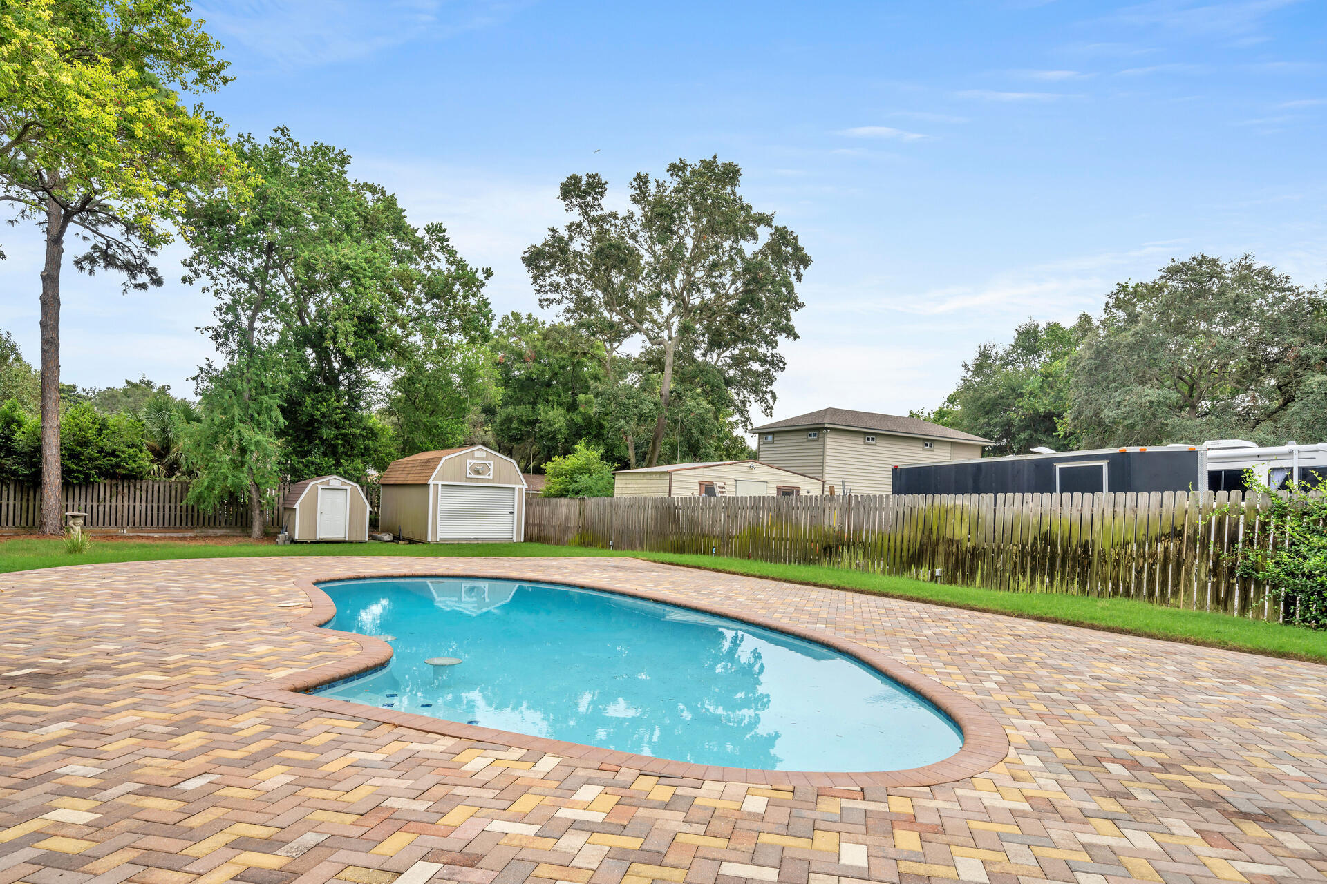 536 Benning Drive Destin, FL 32541 - Photo 41 of 46 a view of a swimming pool with a patio and a yard