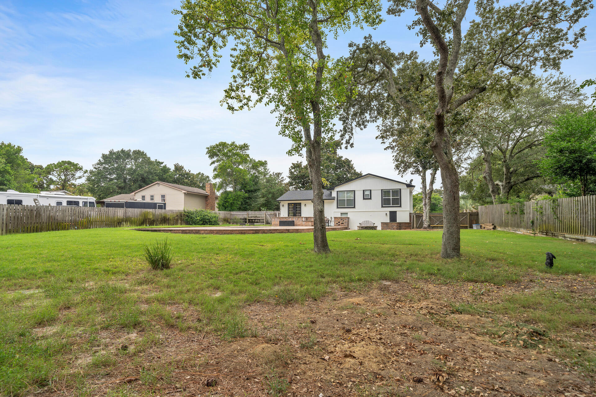 536 Benning Drive Destin, FL 32541 - Photo 45 of 46 a house with huge green field in front of it