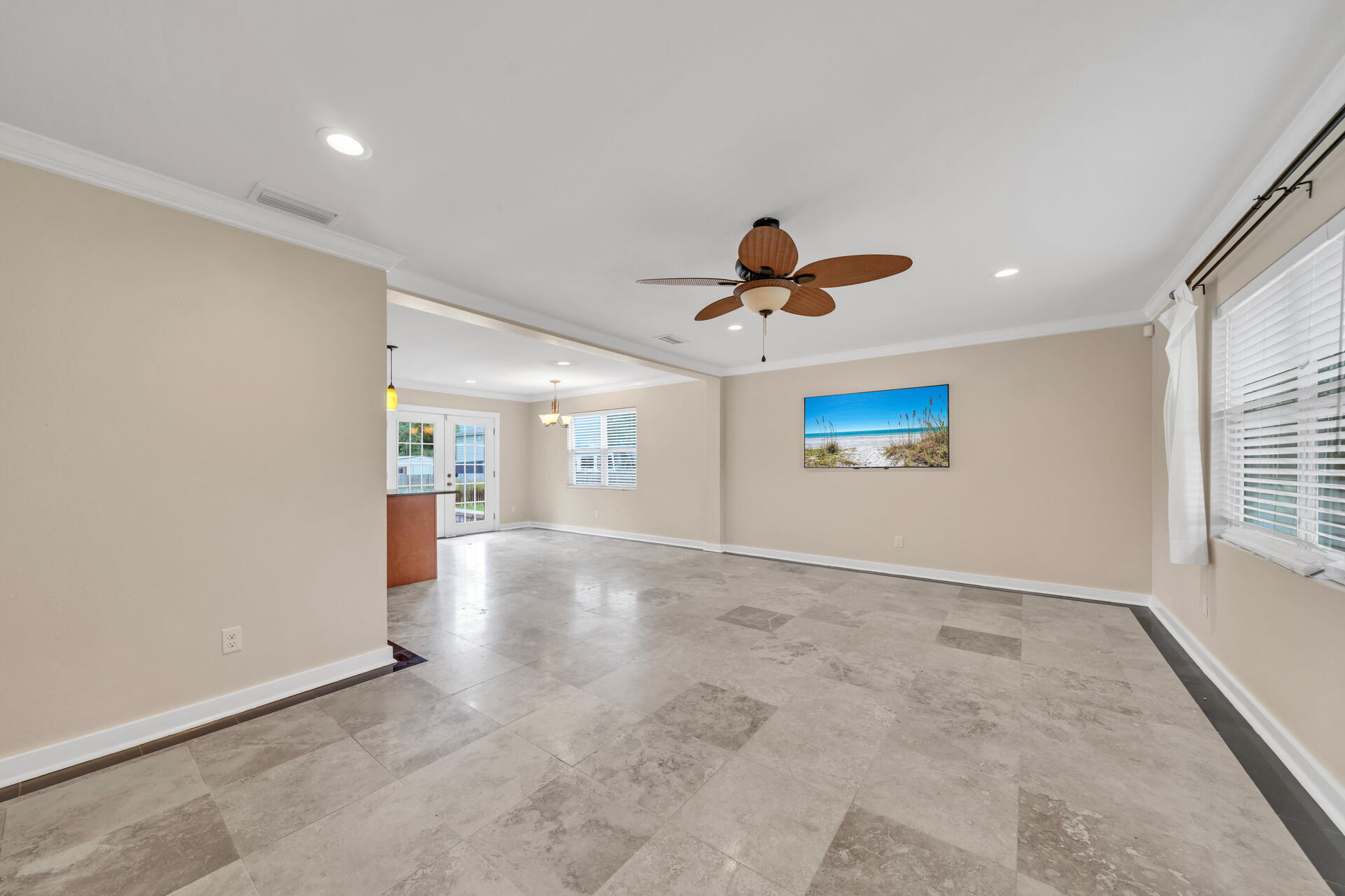 536 Benning Drive Destin, FL 32541 - Photo 9 of 46 an empty room with windows and ceiling fan