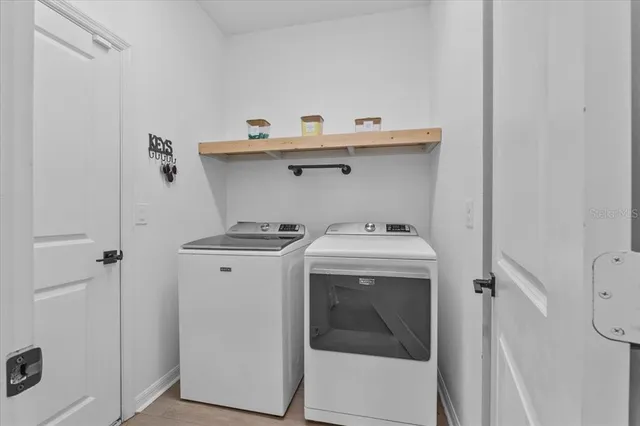 a room with wooden floor and breakfast area