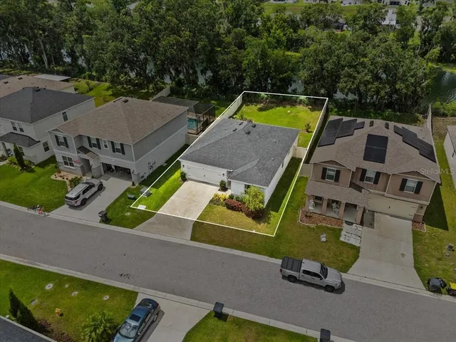 an aerial view of a house with a garden