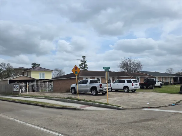 a view of building with car parked