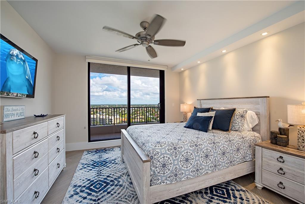 850 South Collier Boulevard, Unit 1103 Marco Island, FL 34145 - Photo 12 of 24 a bedroom with a large bed and a window