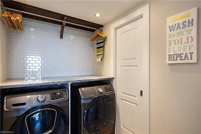 a utility room with dryer and washer