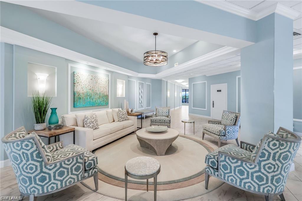 850 South Collier Boulevard, Unit 1103 Marco Island, FL 34145 - Photo 15 of 24 a living room with furniture and a large window