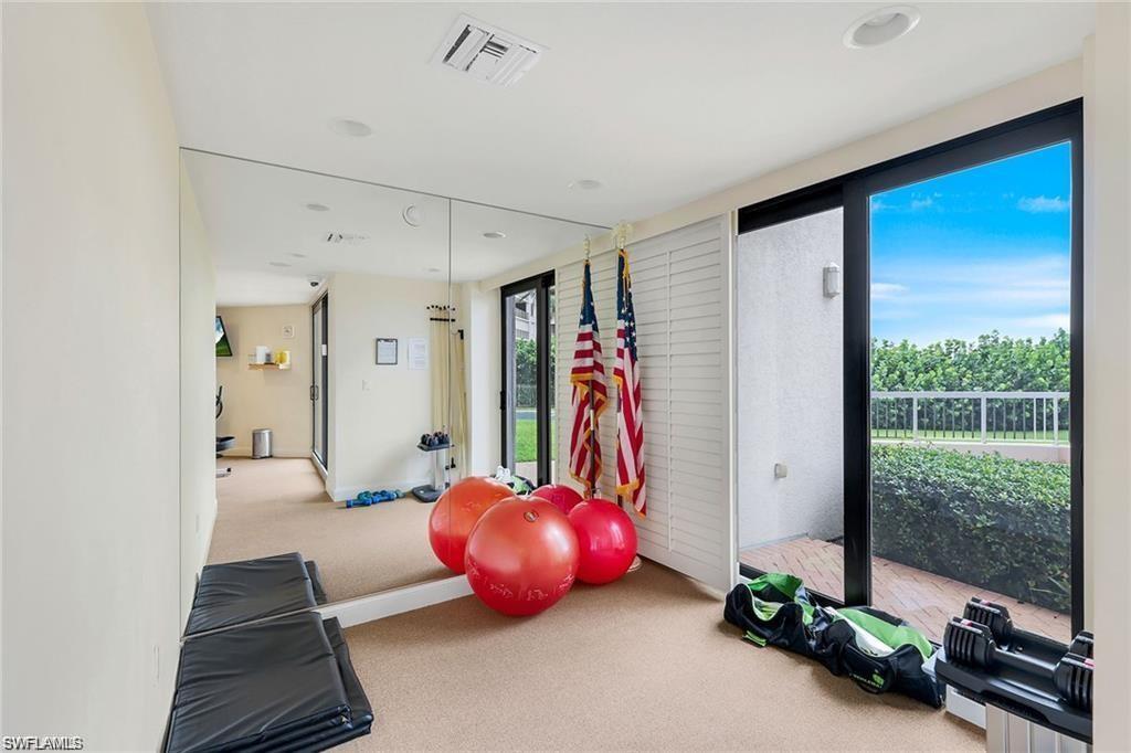 850 South Collier Boulevard, Unit 1103 Marco Island, FL 34145 - Photo 18 of 24 a view of a livingroom with furniture and floor to ceiling window