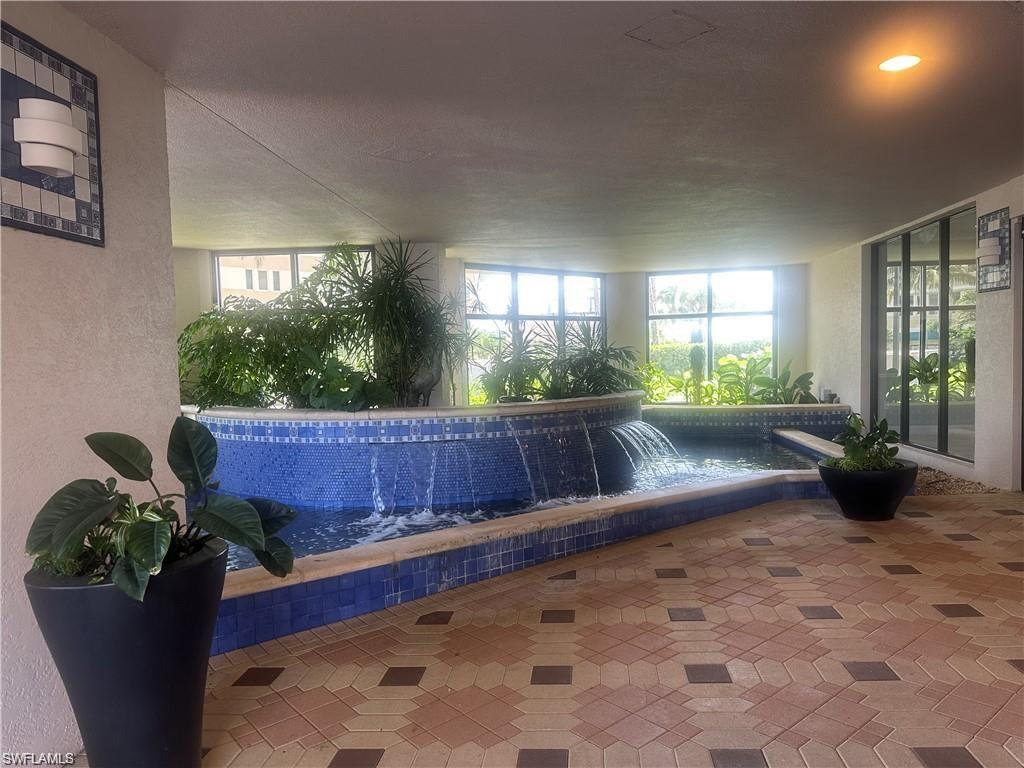 850 South Collier Boulevard, Unit 1103 Marco Island, FL 34145 - Photo 23 of 24 a view of a room with furniture and potted plants