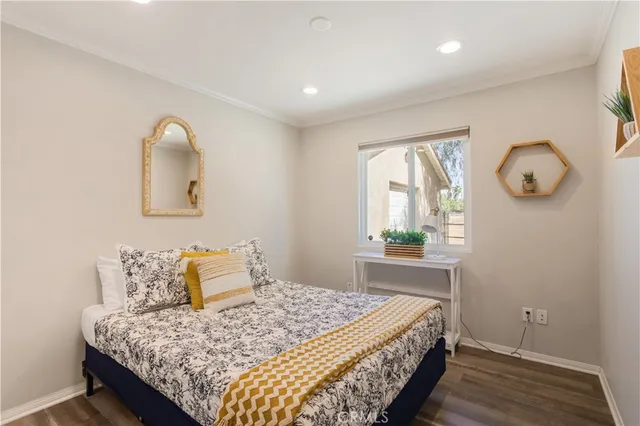 a bedroom with bed and window