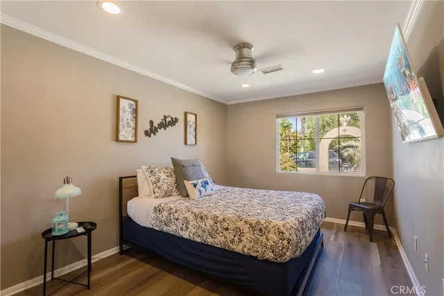 a bedroom with a large bed and a window