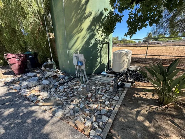 a view of a backyard with plants and trees