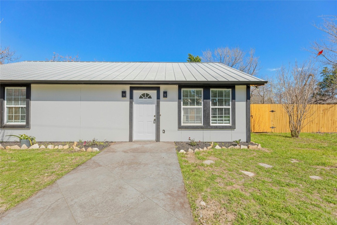605 Arthur Street Elgin, TX 78621 - Photo 1 of 1 a front view of a house with a garden and yard