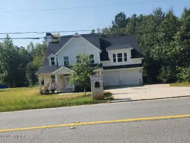 front view of house with a yard