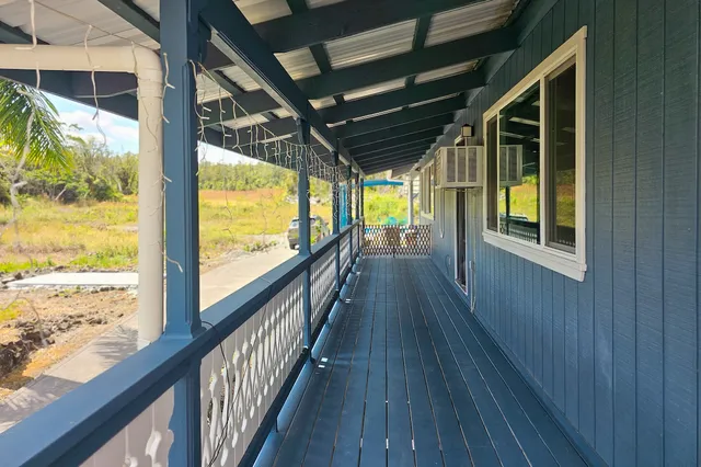 a view of porch with wooden floor