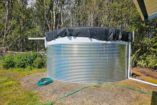 a view of a table and chairs under an umbrella